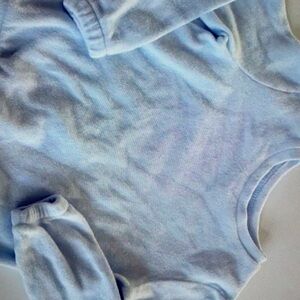 Simple design features vibrant floral print blouse